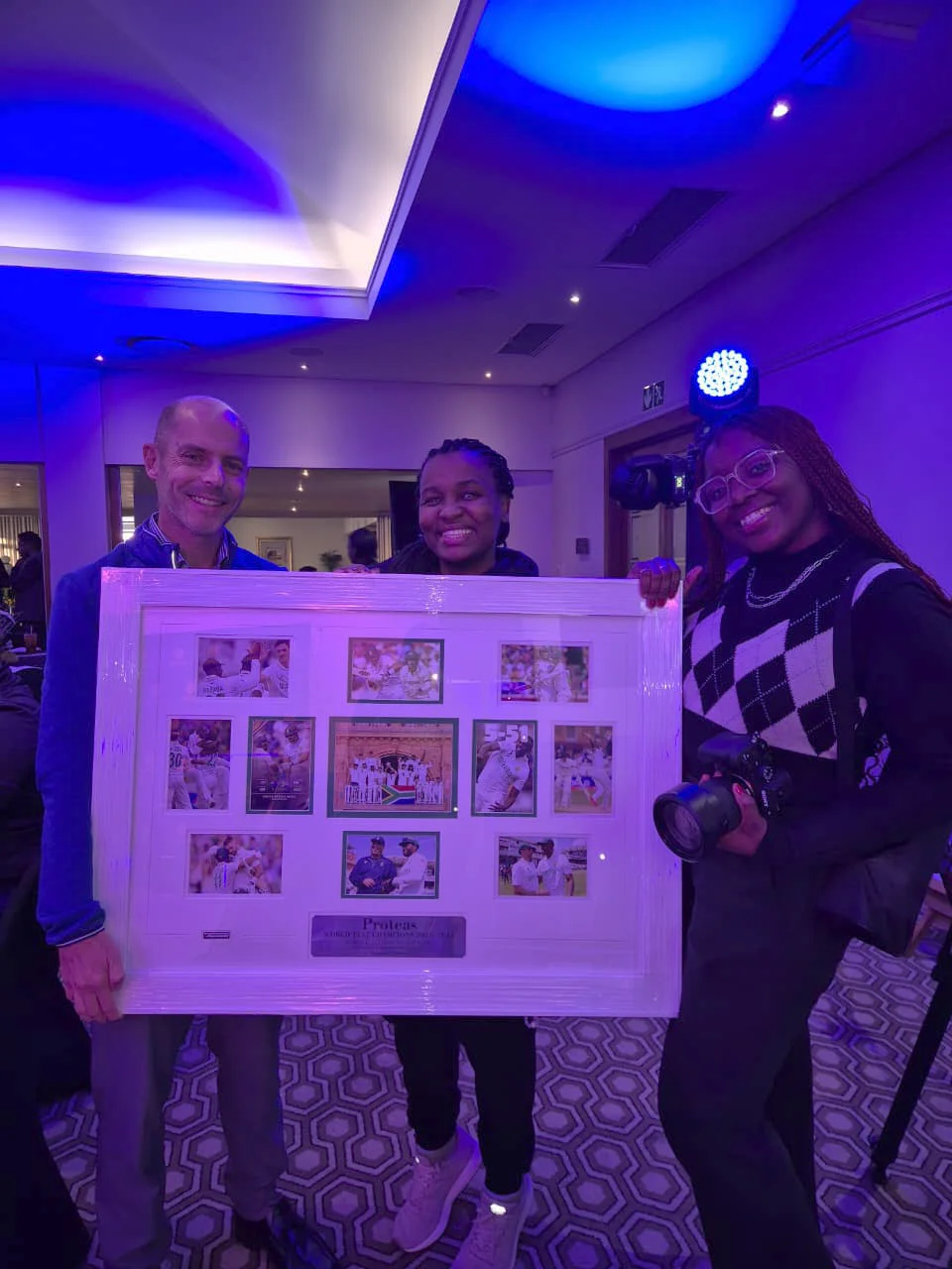 Auction winner receives framed piece